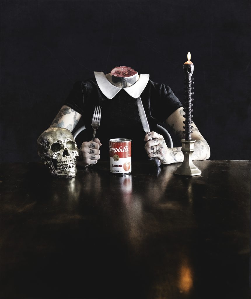 headless figure holding utensils