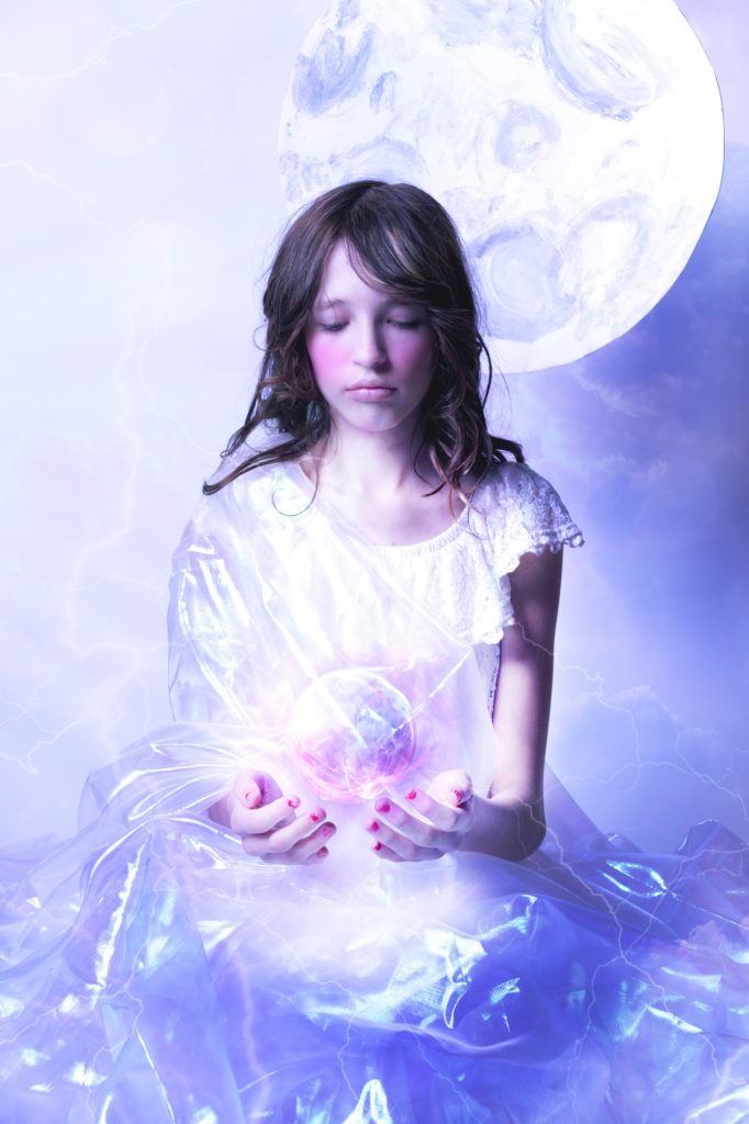 girl holding magic light orb