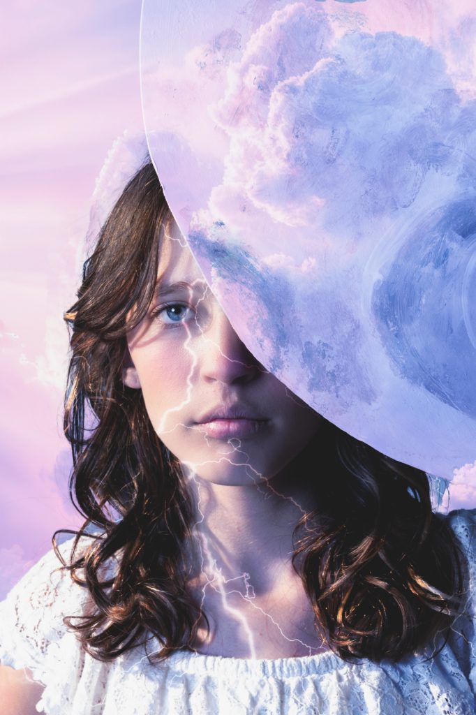 girl looking behind moon