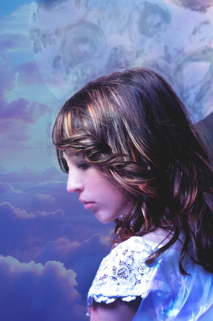girl in dreamy clouds with moon