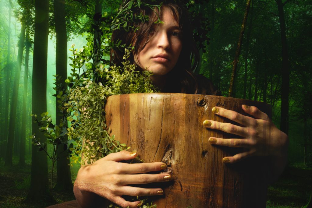 girl and stump in forest