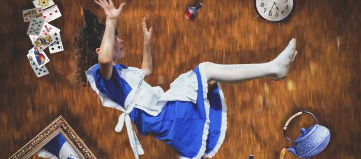 girl falling down hole with objects around her